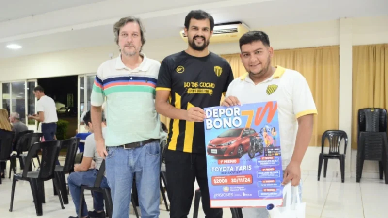 Representantes de una entidad deportiva muestran el afiche del Deporbono 7.